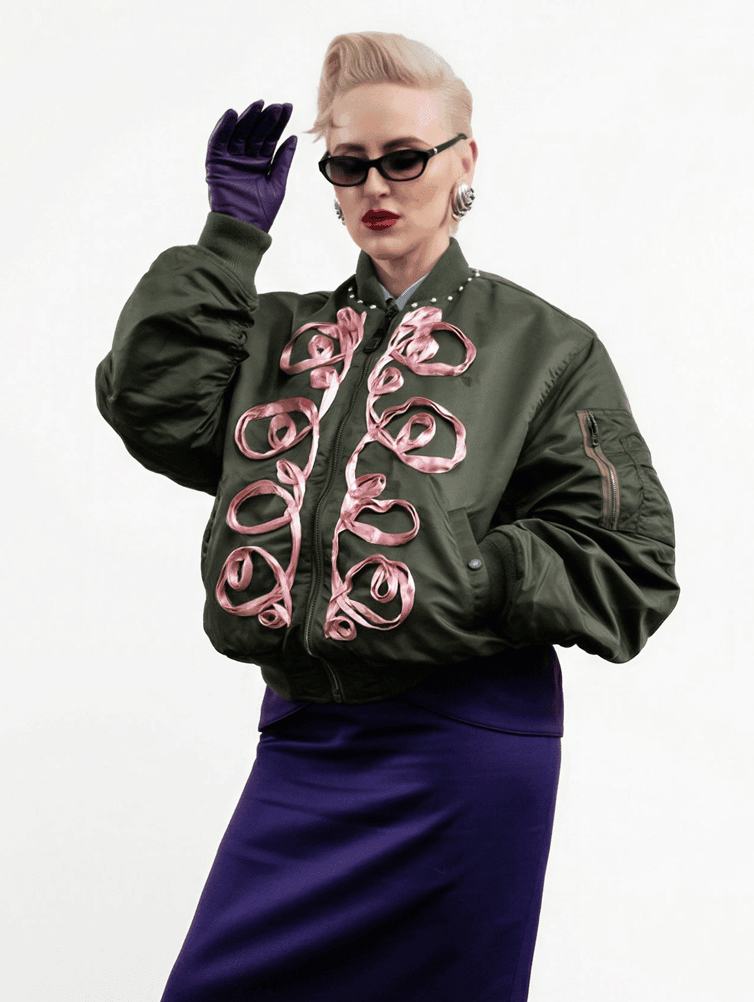 Custom Lou Menais wordmark applied on a contemporary couture garment, showcasing the visual identity developed for the fashion house.